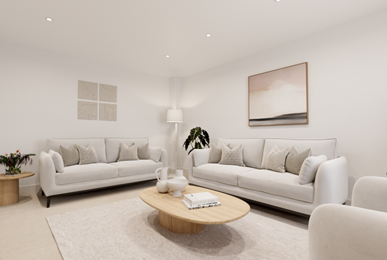 A living room with two white sofas, a coffee table, and artwork on the wall.