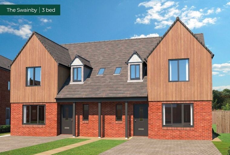 A modern semi-detached house with red brick and wood cladding under a tiled roof.