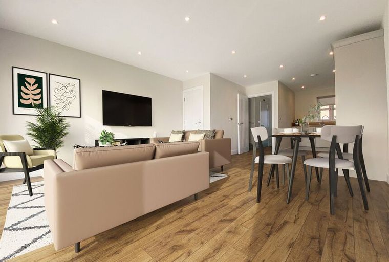 A living and dining area with a sofa, chairs, and a dining table.