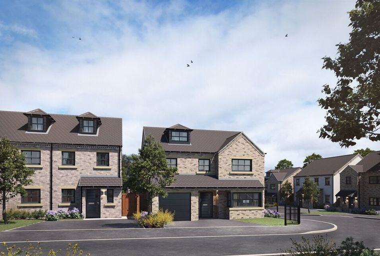 A street view of modern houses with stone exteriors and dormer windows under a cloudy sky.