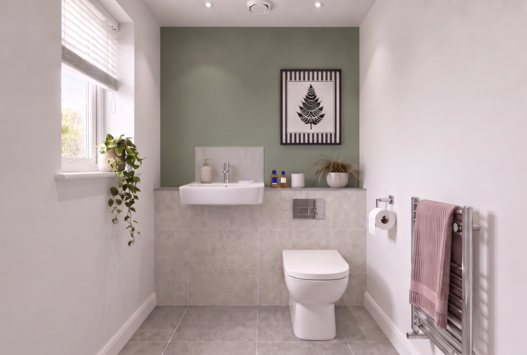 A modern bathroom with a sink, toilet, and tiled walls.