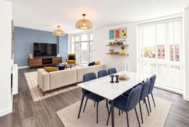 A dining area and living room with a table, chairs, sofa, and television.