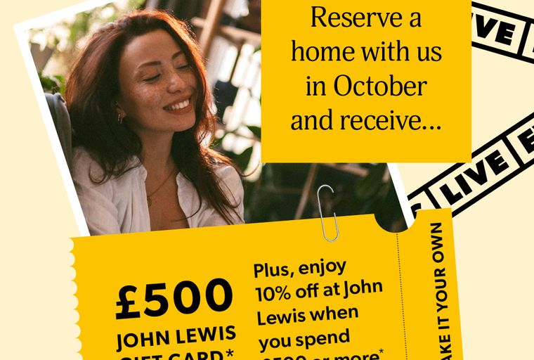 A woman smiling with a yellow note and a gift card.