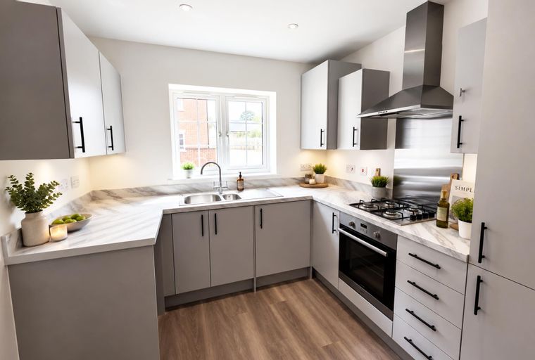 A modern kitchen with grey cabinets, marble countertops, a double sink, and a gas hob.