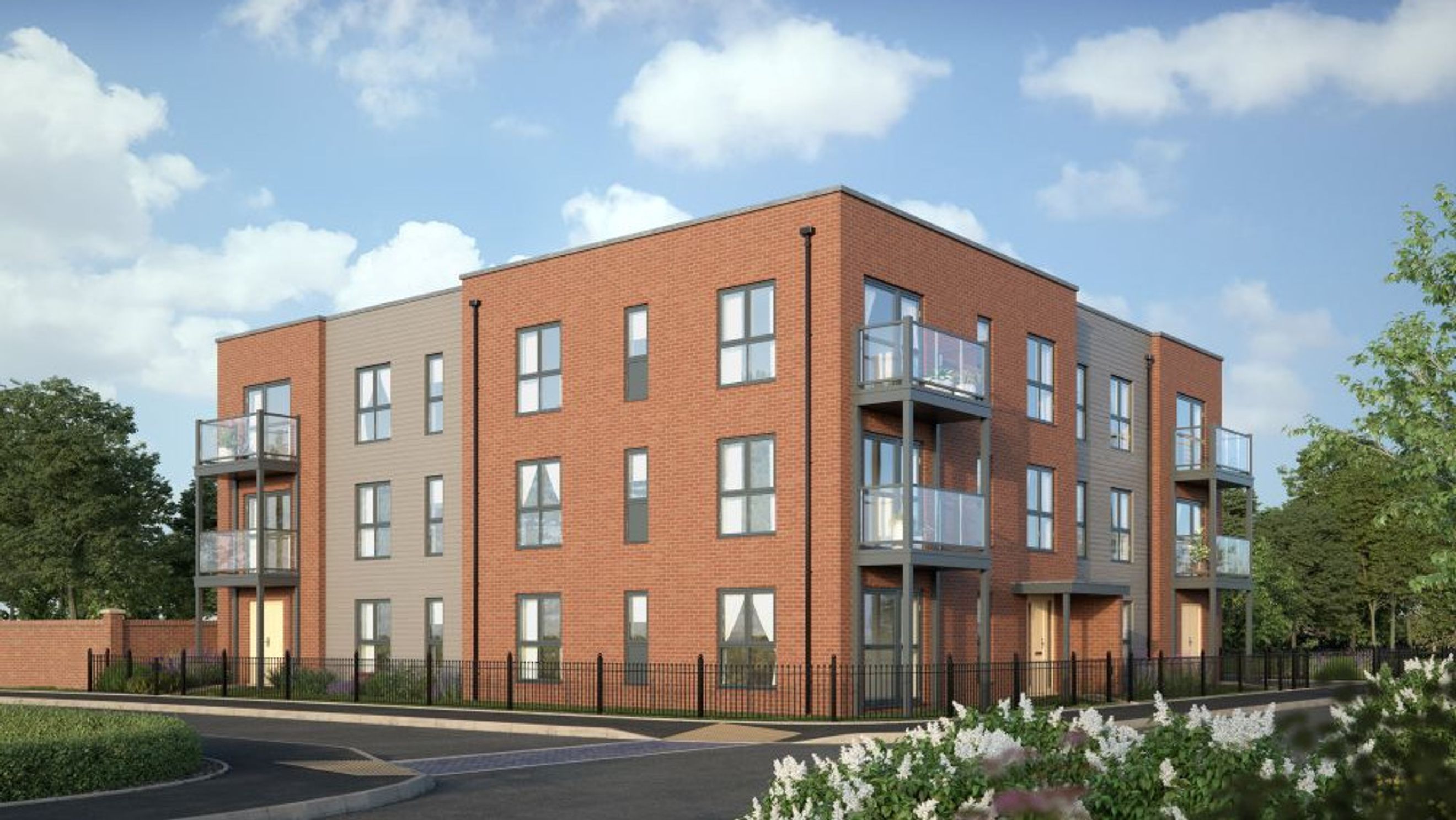 A modern apartment building with brick and grey facades, balconies, and large windows.