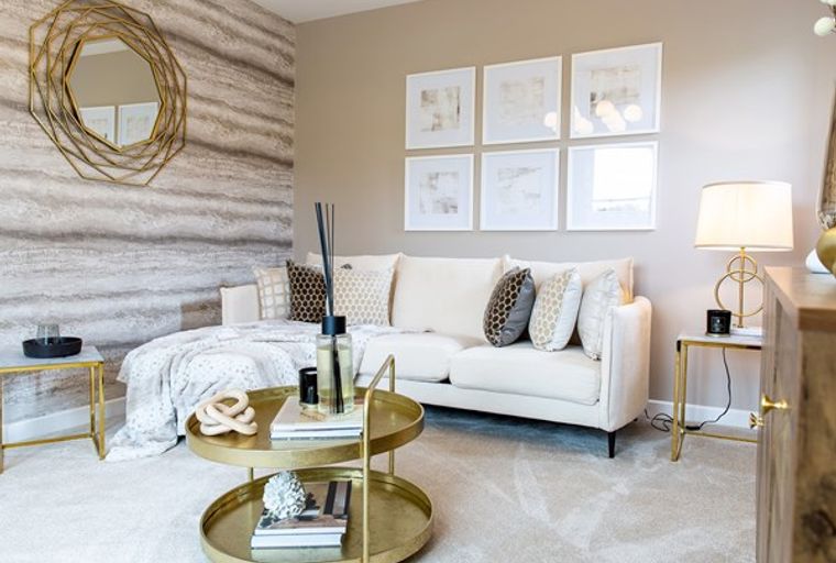 A living room with a sofa, coffee table, and mirror.