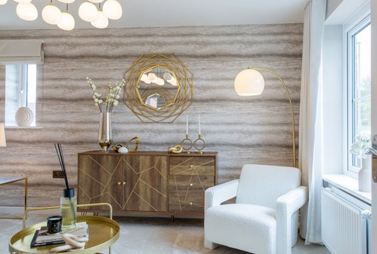 A living room with a sideboard, armchair, and a floor lamp.