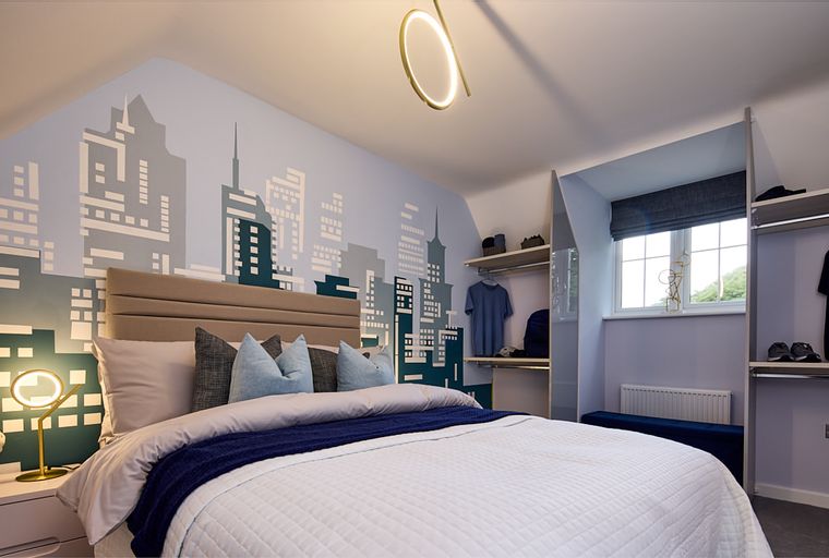 A bedroom with a bed, a city skyline mural, and a closet.