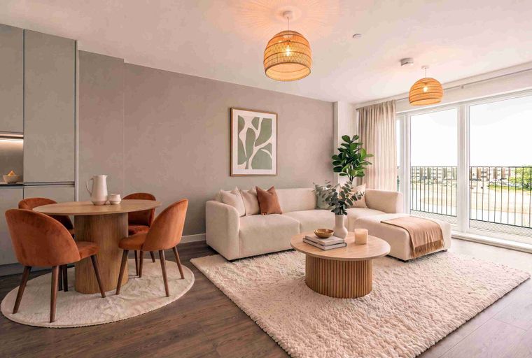 A living and dining area with a sofa, coffee table, dining table, and chairs.