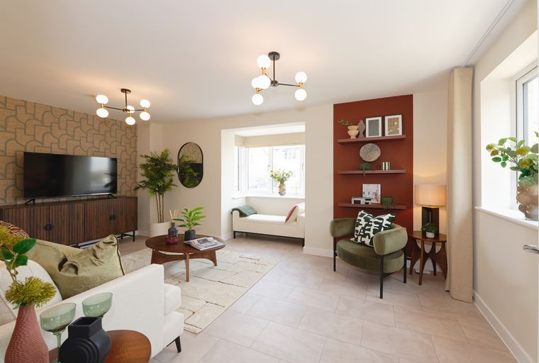 A living room with a TV, sofa, chair, and coffee table.