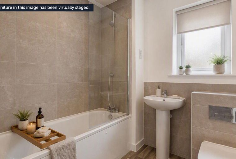 A bathroom with a bathtub, shower, sink, and toilet.
