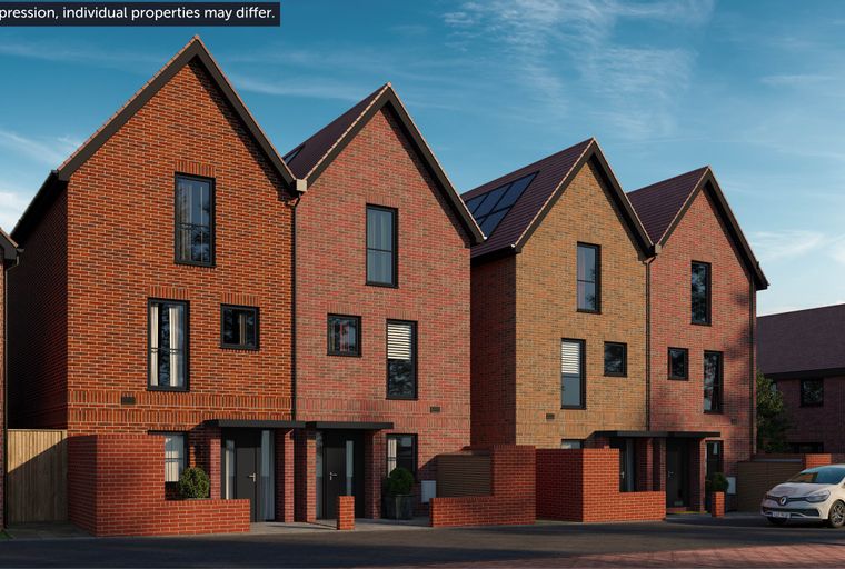 A row of modern red brick townhouses with black window frames and solar panels on the roof.