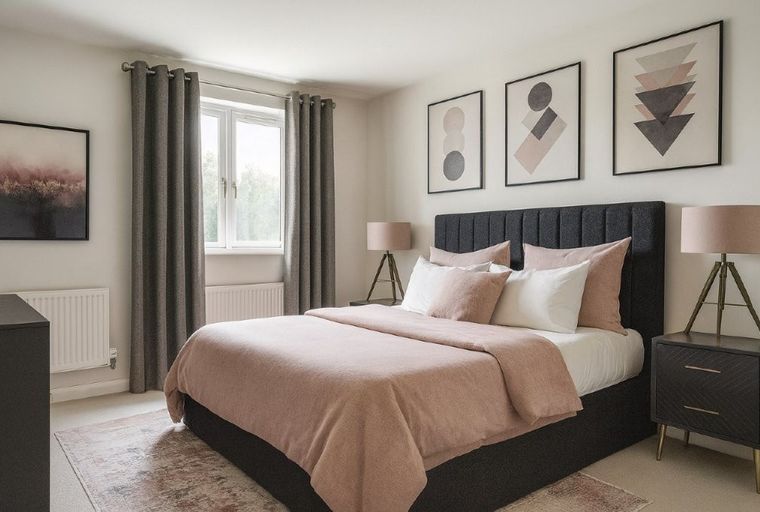 A bedroom with a bed, pillows, and lamps.