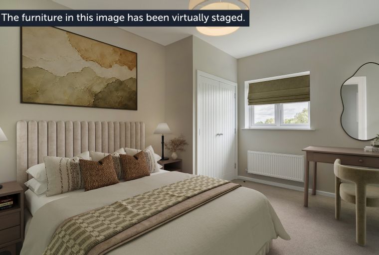 A bedroom with a bed, bedside tables, a dresser, and a window.