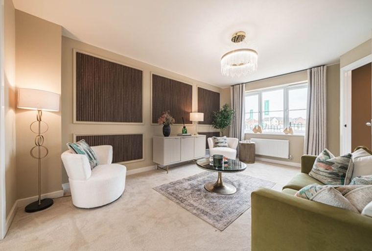 A living room with a sofa, chairs, coffee table, and a floor lamp.