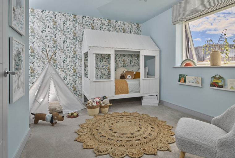 A children's bedroom with a house-shaped bed, a teepee, and a round rug.