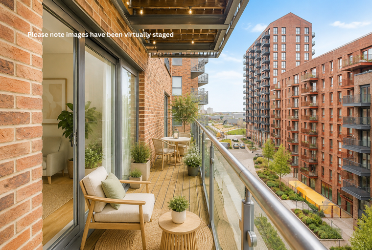 A balcony with outdoor furniture and a view of apartment buildings.