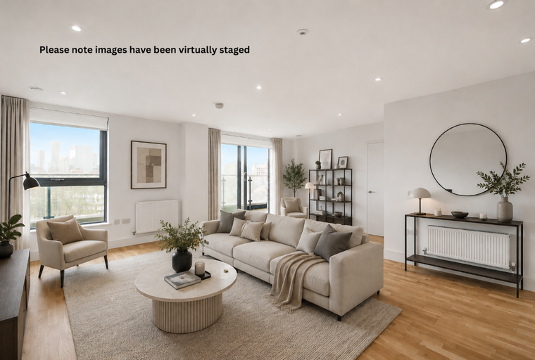 A living room with a sectional sofa, coffee table, armchair, and large windows.