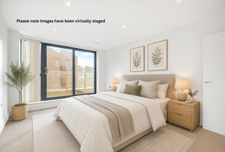 A bedroom with a bed, bedside tables, and a large sliding glass door.