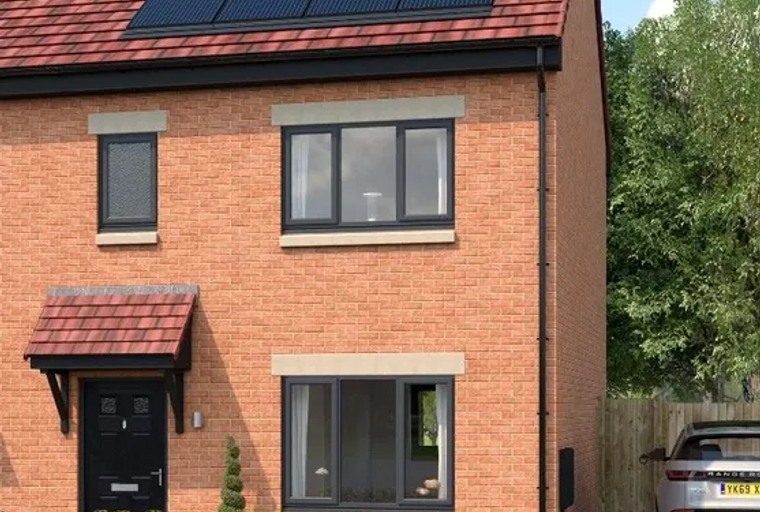 A brick house with solar panels on the roof, a black front door, and a car parked in the driveway.