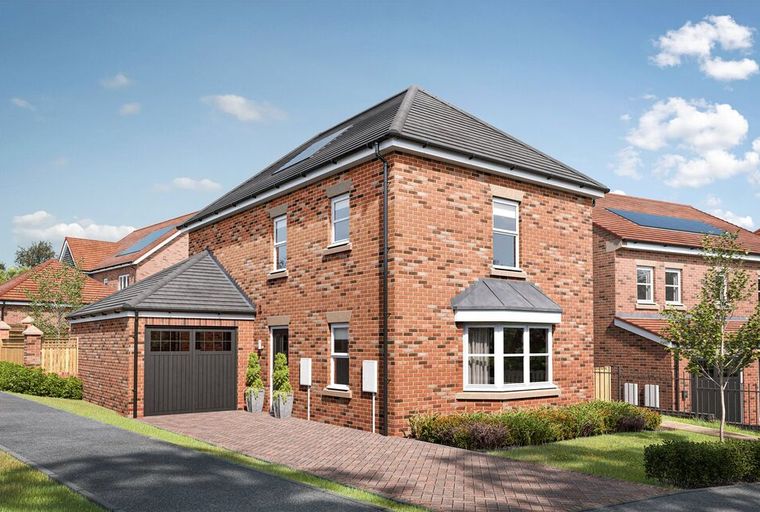 A brick house with a garage and a bay window.