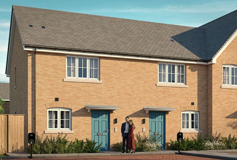 A pair of brick townhouses with teal front doors and white-framed windows.