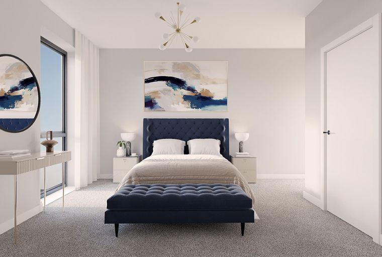 A bedroom with a bed, nightstands, a bench, a console table, and a mirror.