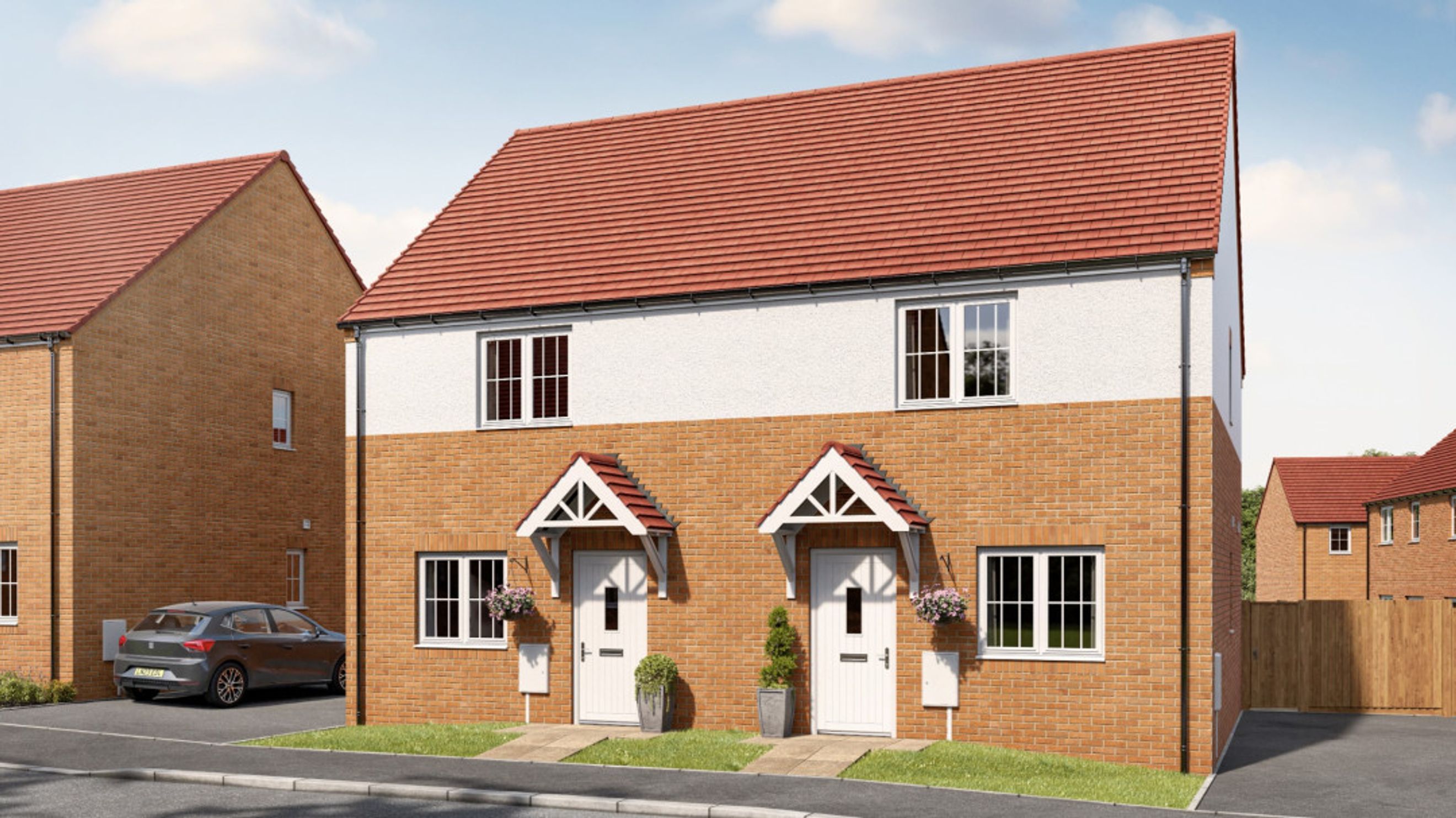 A pair of semi-detached houses with brick lower walls and white upper walls, under red tiled roofs.