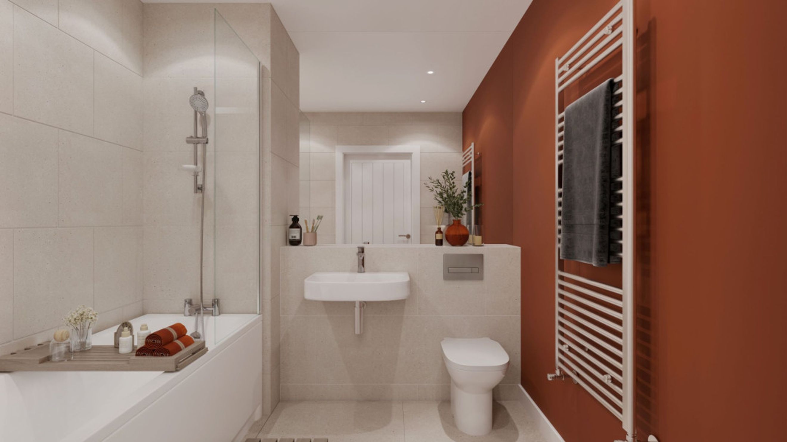 A bathroom with a bathtub, sink, toilet, and a heated towel rail.