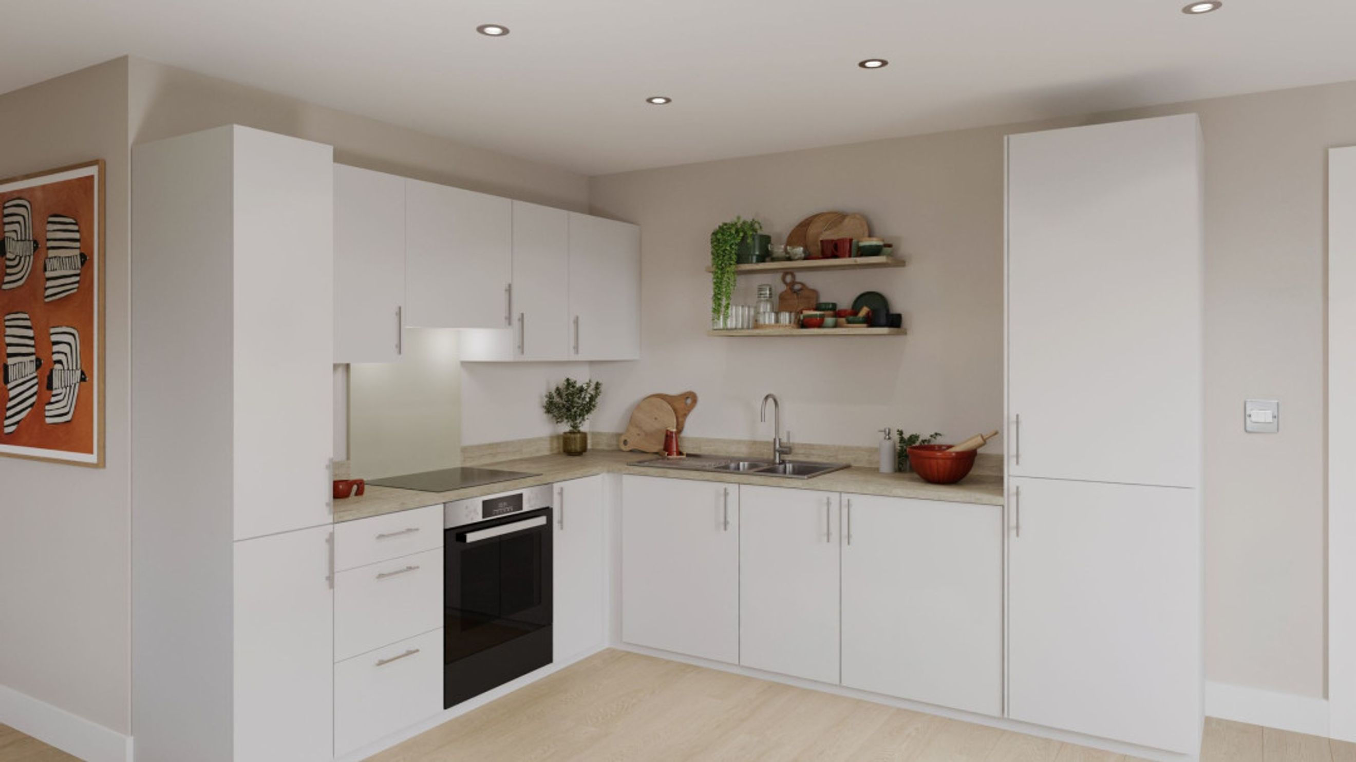 A modern L-shaped kitchen with white cabinets, a built-in oven, and a double sink.
