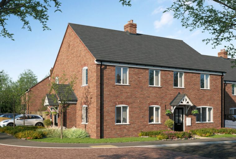 A row of brick townhouses with dark grey roofs and white-framed windows, parked cars, and trees.