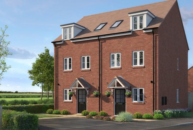 A pair of red brick semi-detached houses with black front doors and white windows under a tiled roof.