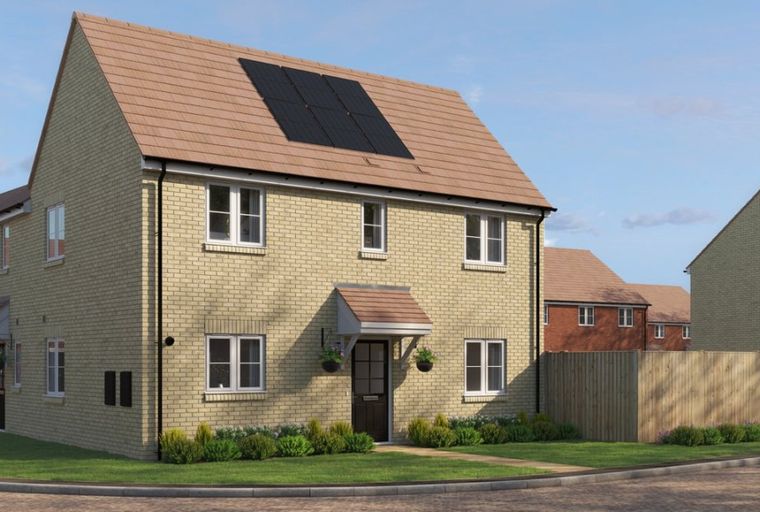 A new build house with solar panels on the roof.