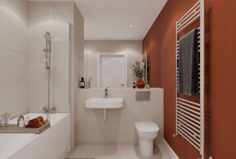 A bathroom with a bathtub, sink, toilet, and a heated towel rail.
