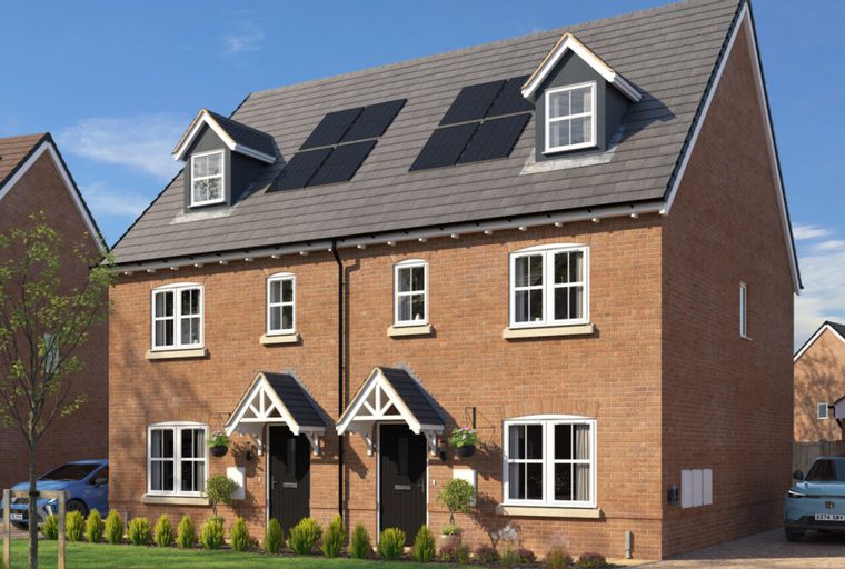A row of modern brick houses with solar panels on the roof.