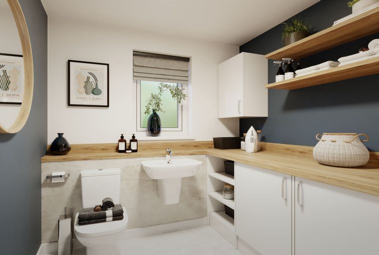 A laundry room with a toilet, sink, cabinets, and shelves.