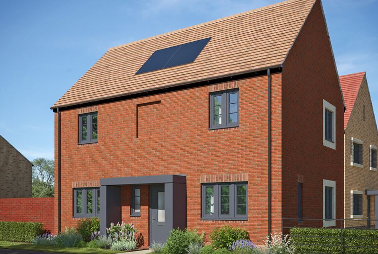 A red brick house with a grey entrance porch and solar panels on the roof.