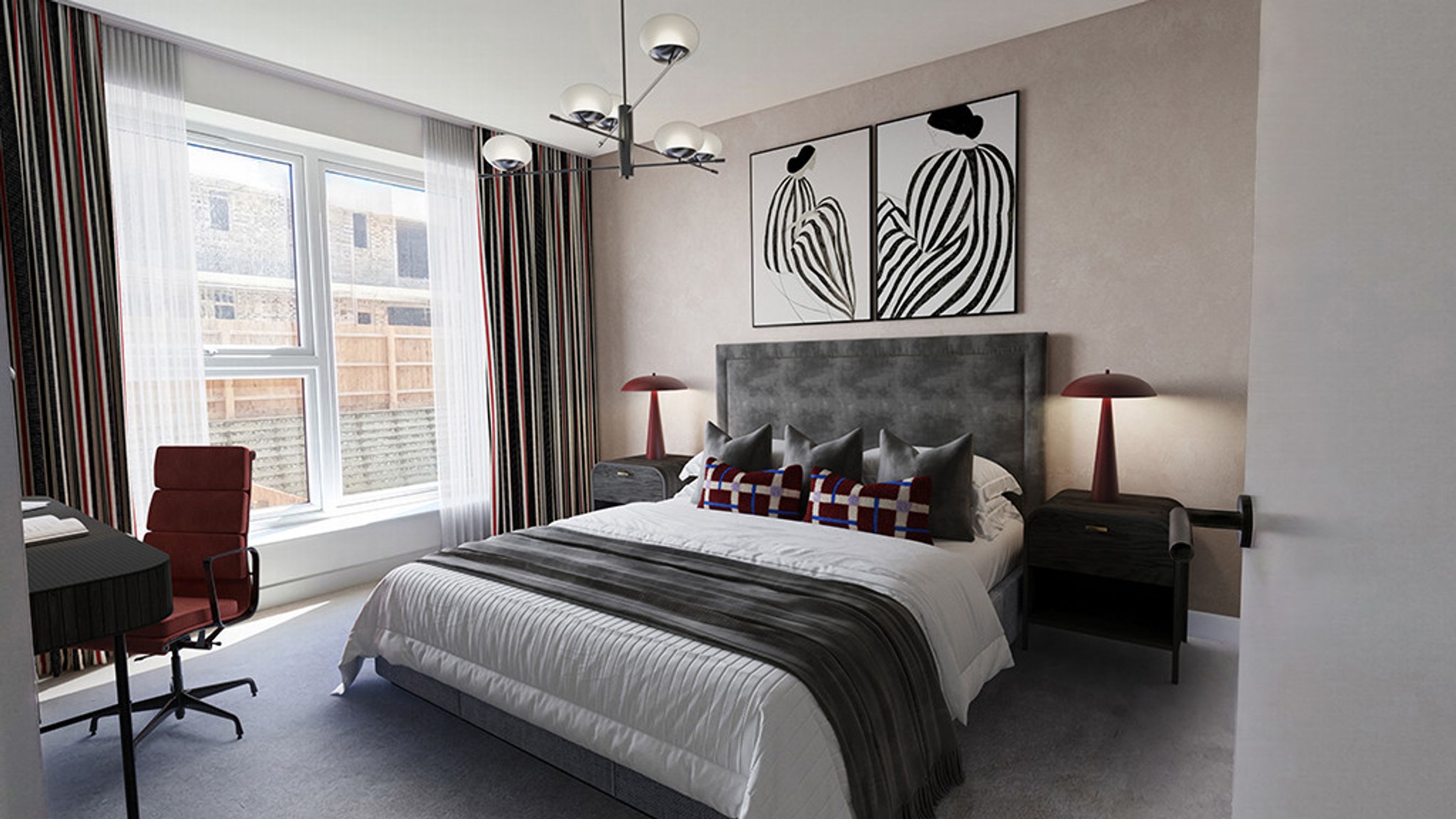 A bedroom with a bed, bedside tables, lamps, artwork, a window, and a desk.