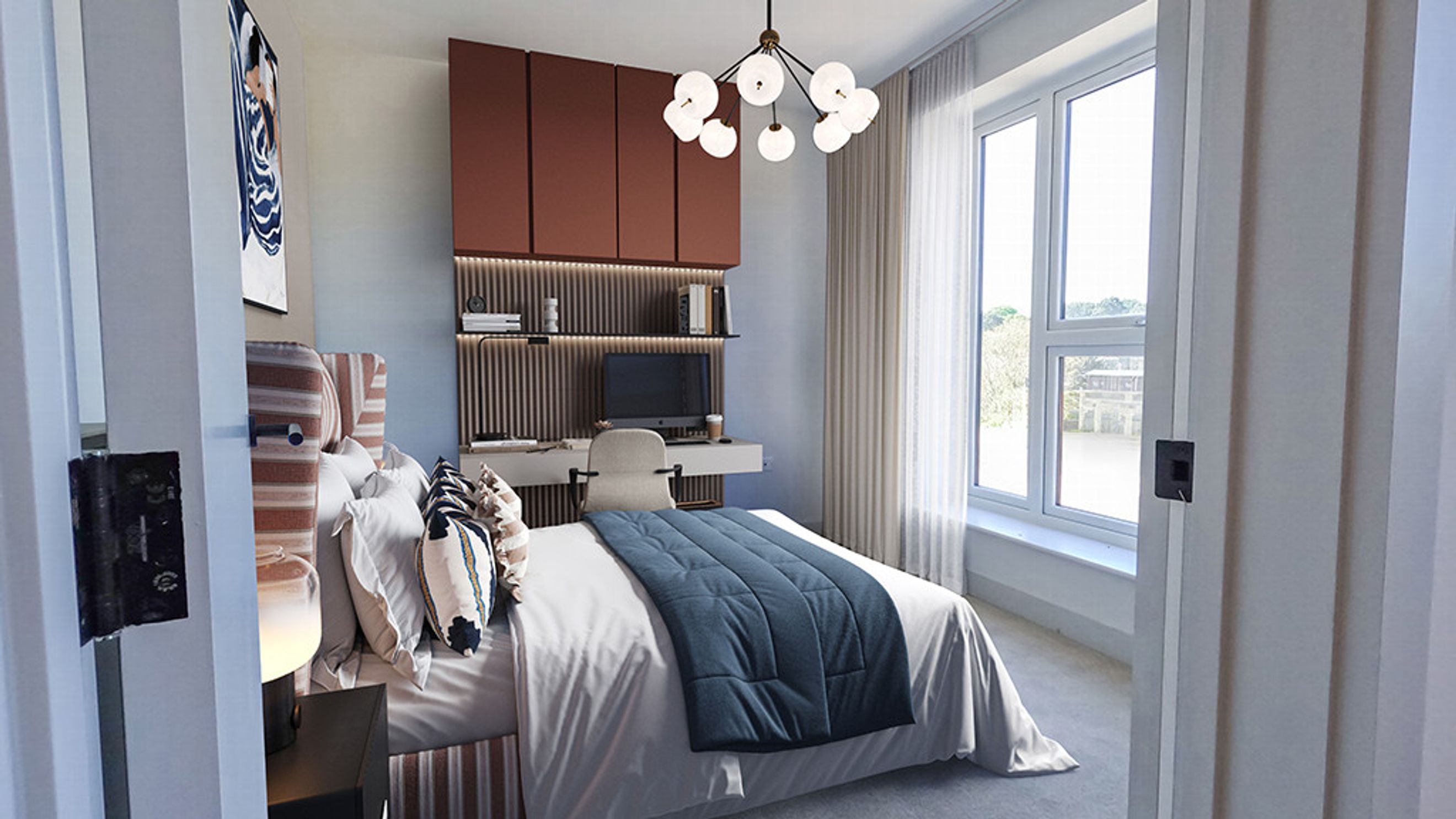 A bedroom with a bed, a desk, and a window.