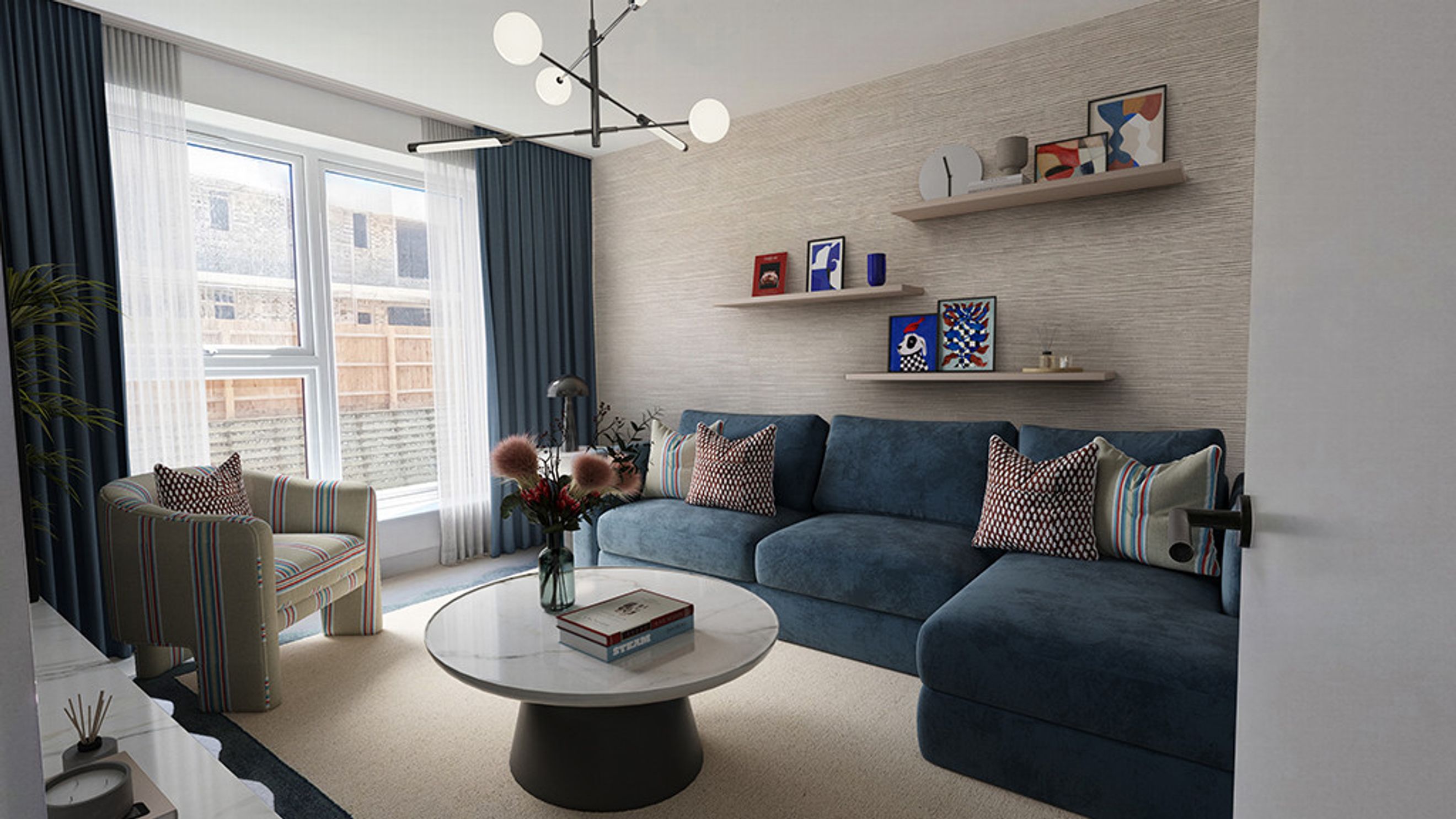 A living room with a blue sectional sofa, a striped armchair, and a coffee table.