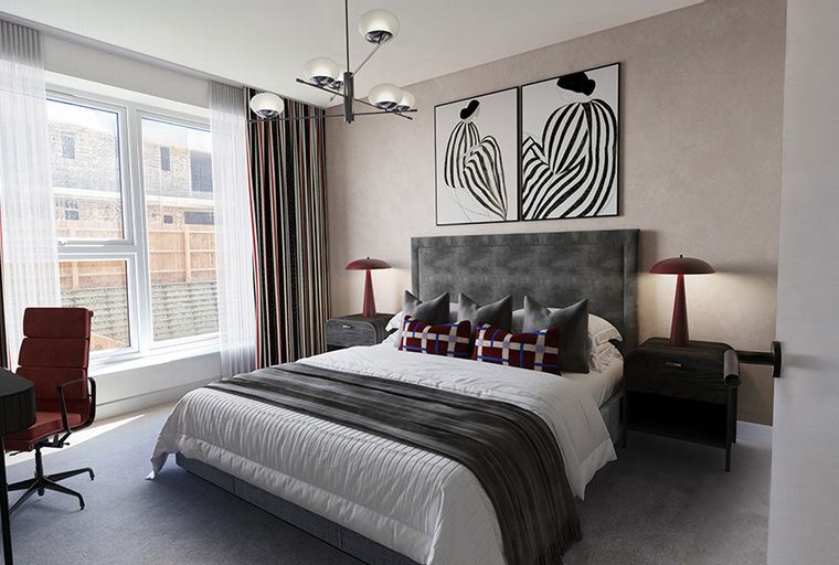 A bedroom with a bed, bedside tables, lamps, artwork, a window, and a desk.