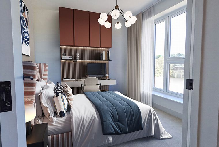 A bedroom with a bed, a desk, and a window.