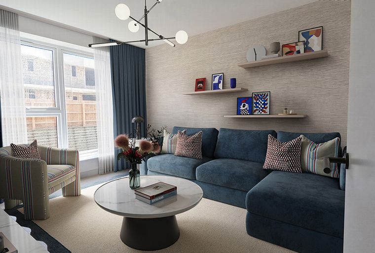 A living room with a blue sectional sofa, a striped armchair, and a coffee table.