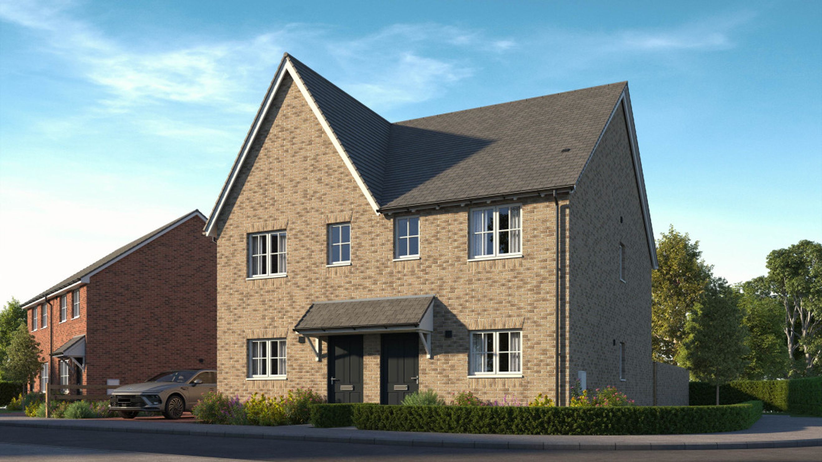 A modern semi-detached house with brick exterior and multiple windows.