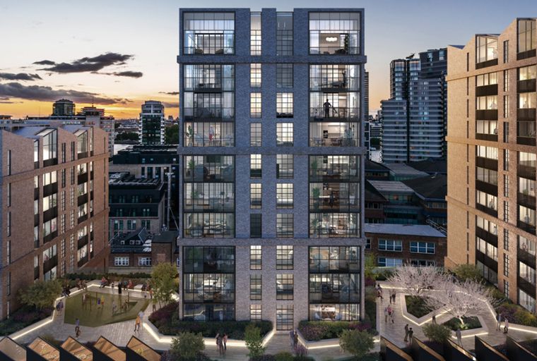 A modern apartment building complex with people in the courtyard.