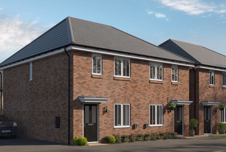 A row of brick townhouses with dark grey roofs and black front doors.