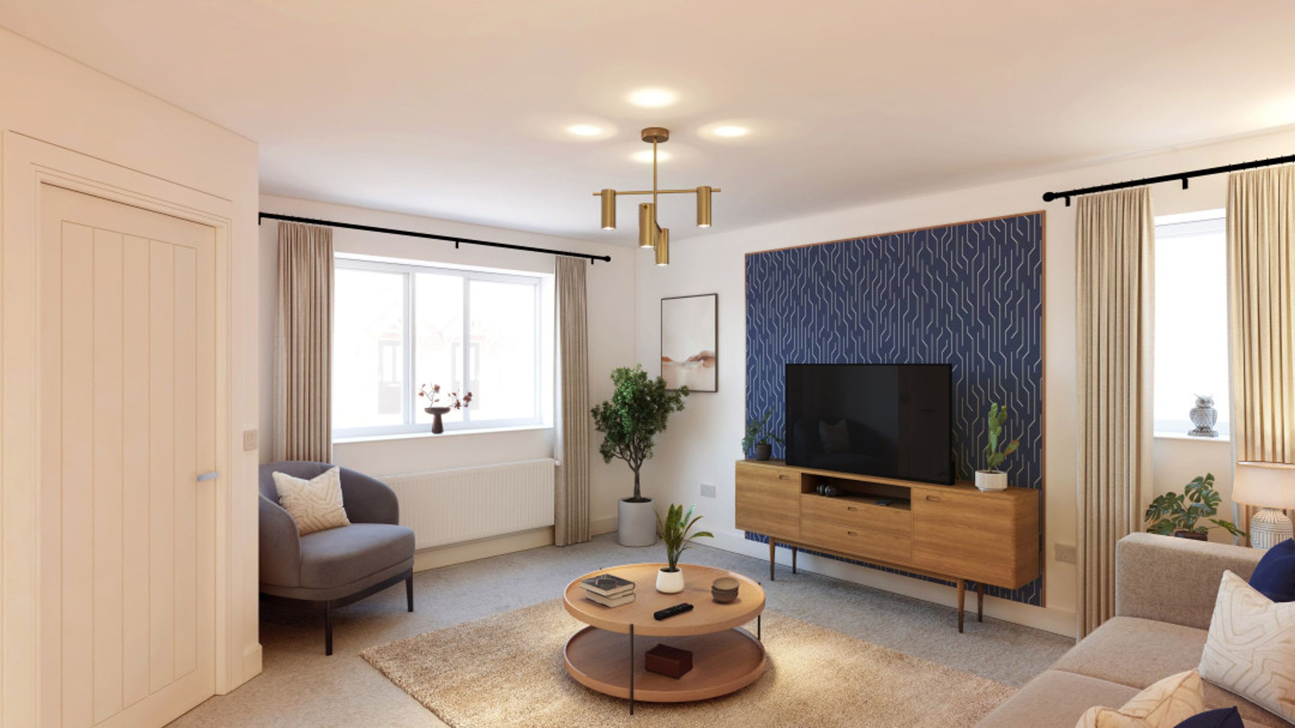 A living room with a sofa, armchair, coffee table, and television.