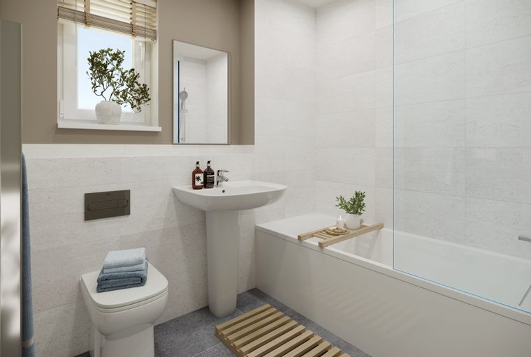 A bathroom with a toilet, sink, and bathtub.