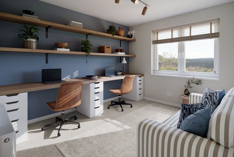 A home office with a long desk, two chairs, shelves, and a sofa.