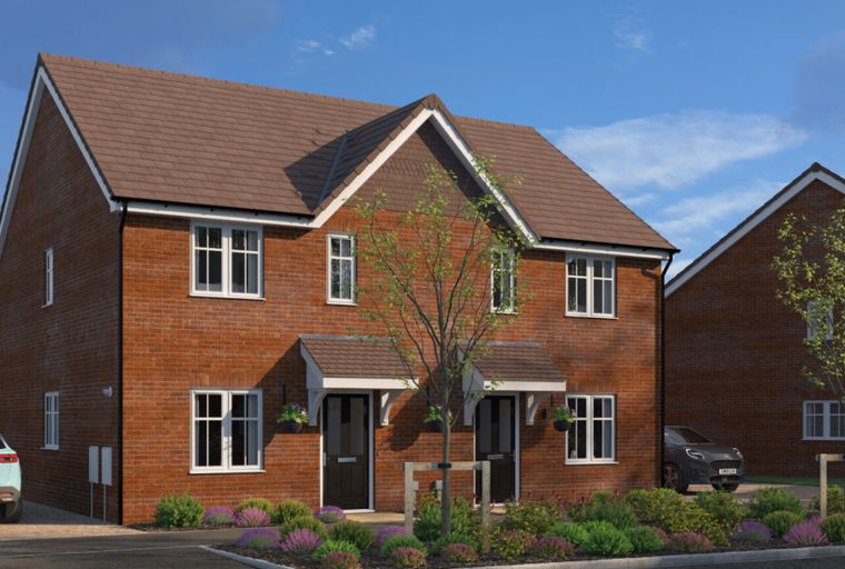 A pair of red brick semi-detached houses with front gardens and driveways.